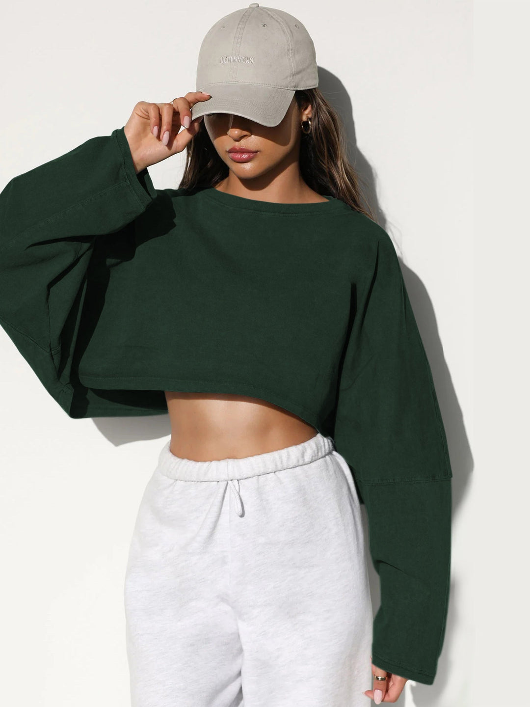 Damernas Avslappnad Cropped Sweatshirt med Låg Skärning och Ballongärmar Mirla-Eva Jonsson