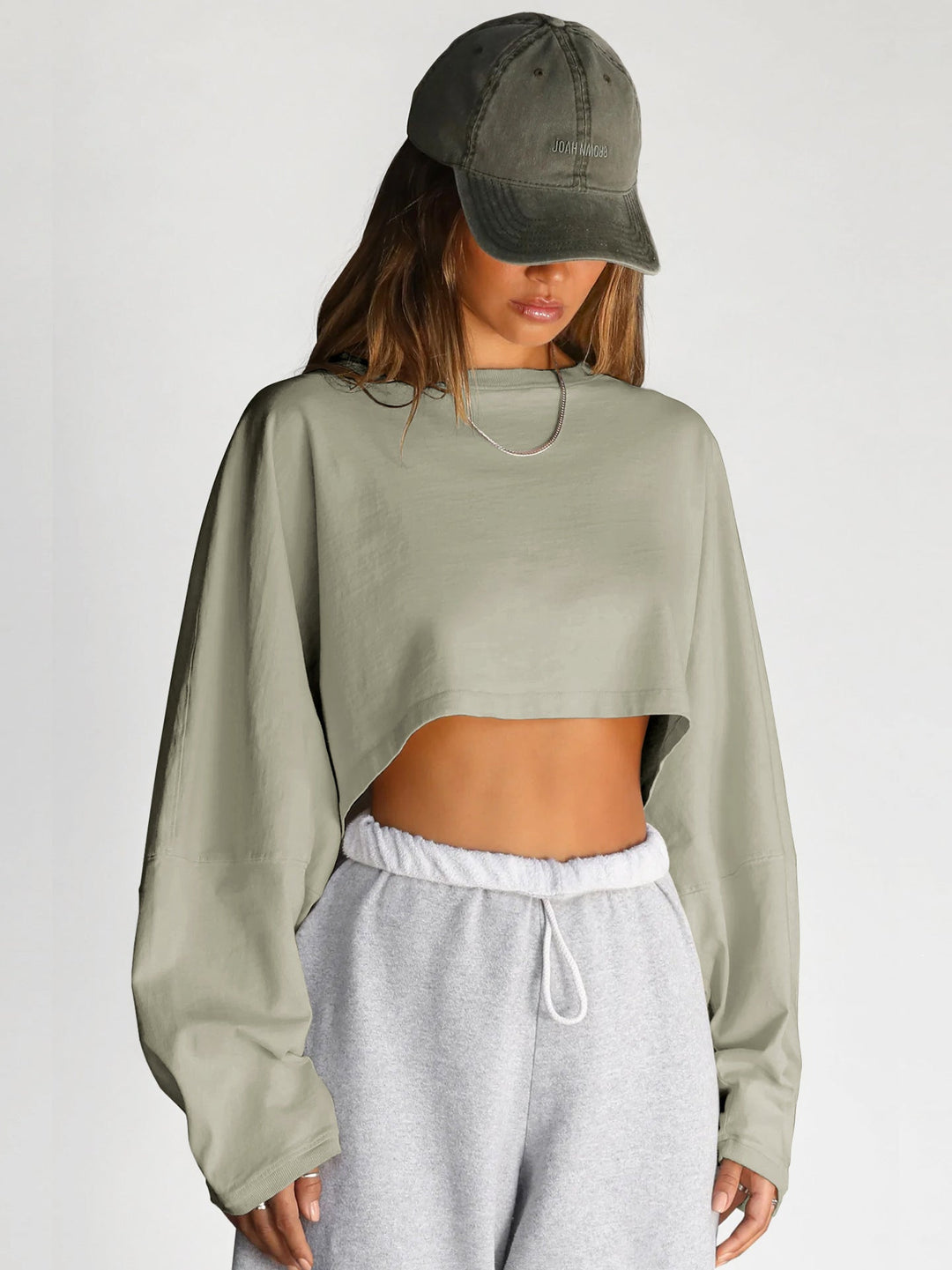 Damernas Avslappnad Cropped Sweatshirt med Låg Skärning och Ballongärmar Mirla-Eva Jonsson