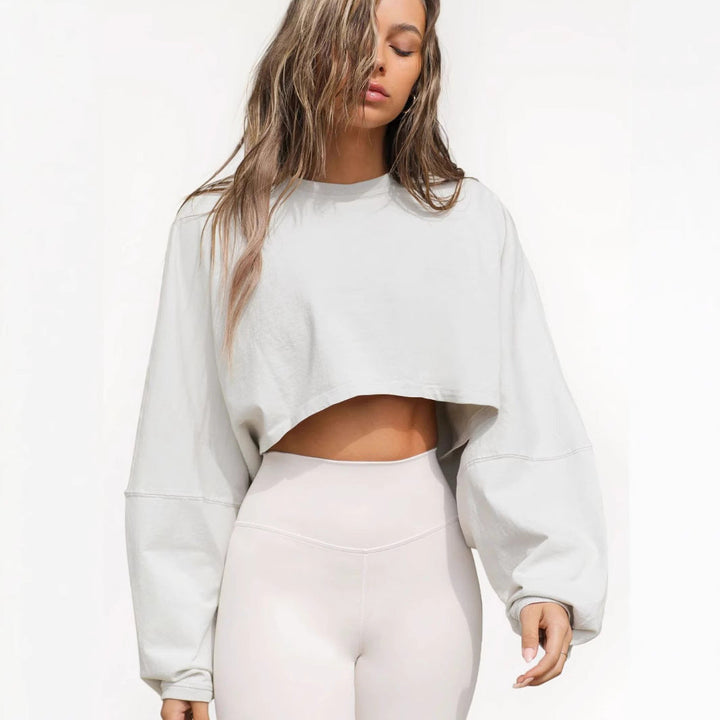 Damernas Avslappnad Cropped Sweatshirt med Låg Skärning och Ballongärmar Mirla-Eva Jonsson