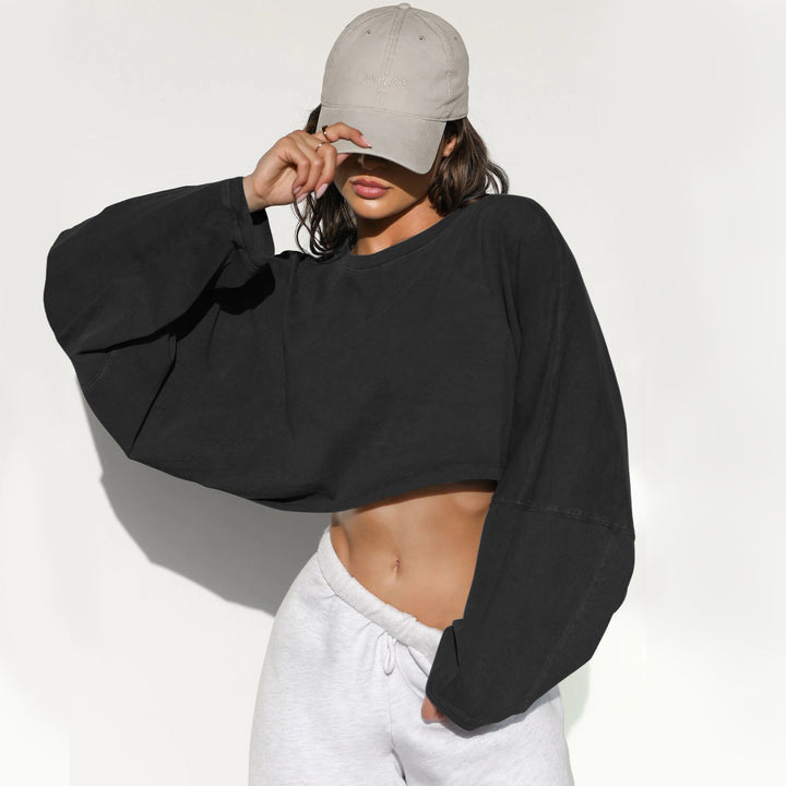 Damernas Avslappnad Cropped Sweatshirt med Låg Skärning och Ballongärmar Mirla-Eva Jonsson
