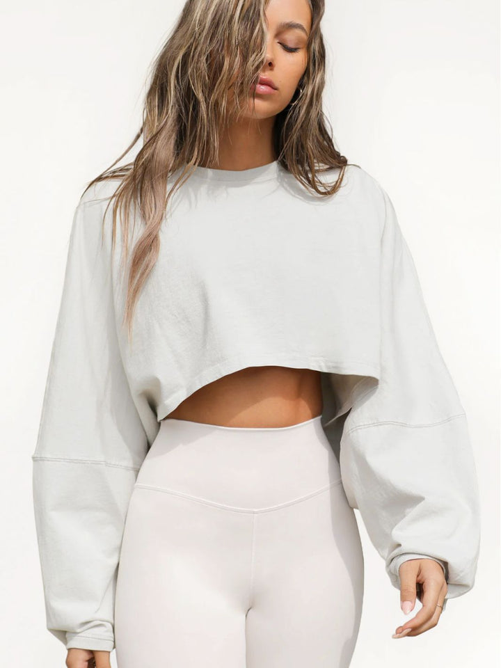 Damernas Avslappnad Cropped Sweatshirt med Låg Skärning och Ballongärmar Mirla-Eva Jonsson