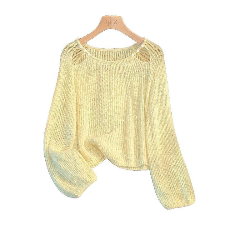 Damernas Avslappnade Tröja med Off-Shoulder Design och Glittrande Detaljer Mirla-Eva Jonsson
