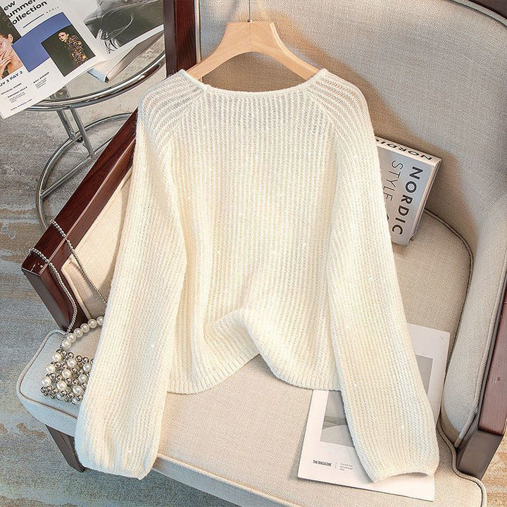 Damernas Avslappnade Tröja med Off-Shoulder Design och Glittrande Detaljer Mirla-Eva Jonsson