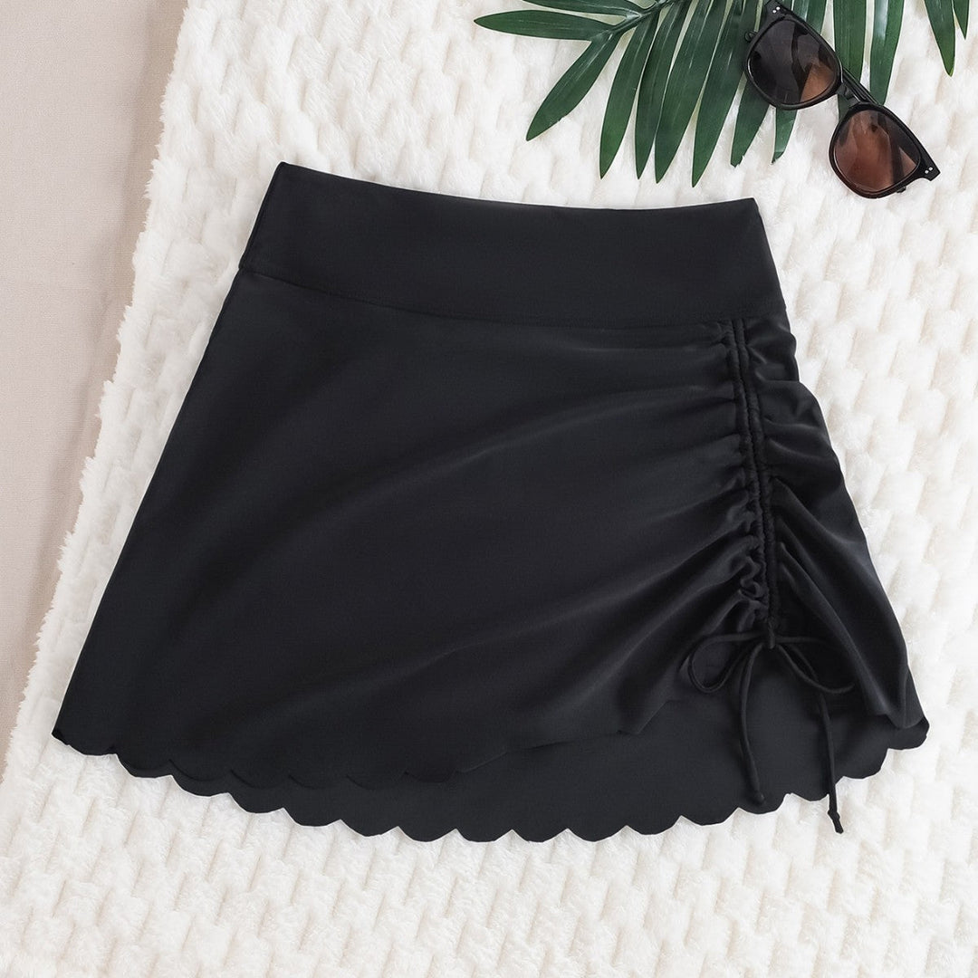 Damernas Baddräkt med Asymmetrisk Drapering och Elegant Vågkant Mirla-Eva Jonsson