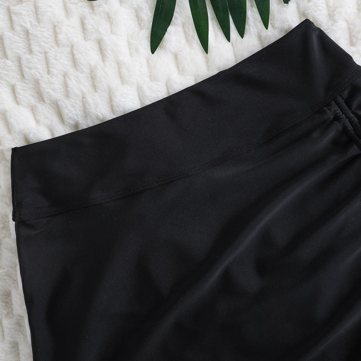 Damernas Baddräkt med Asymmetrisk Drapering och Elegant Vågkant Mirla-Eva Jonsson