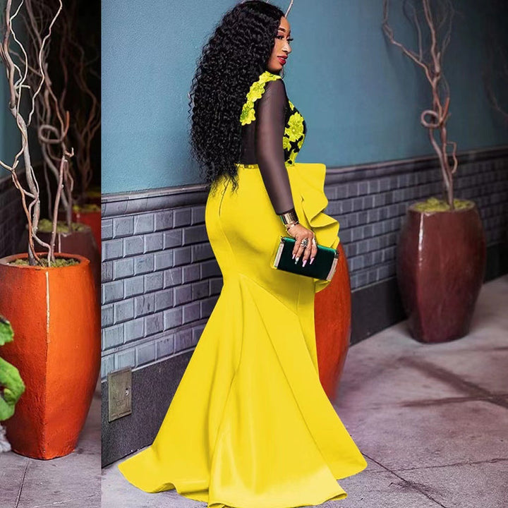 Damernas Elegant Aftonklänning med Transparenta Ärmar och Volangdetalj Mirla-Eva Jonsson