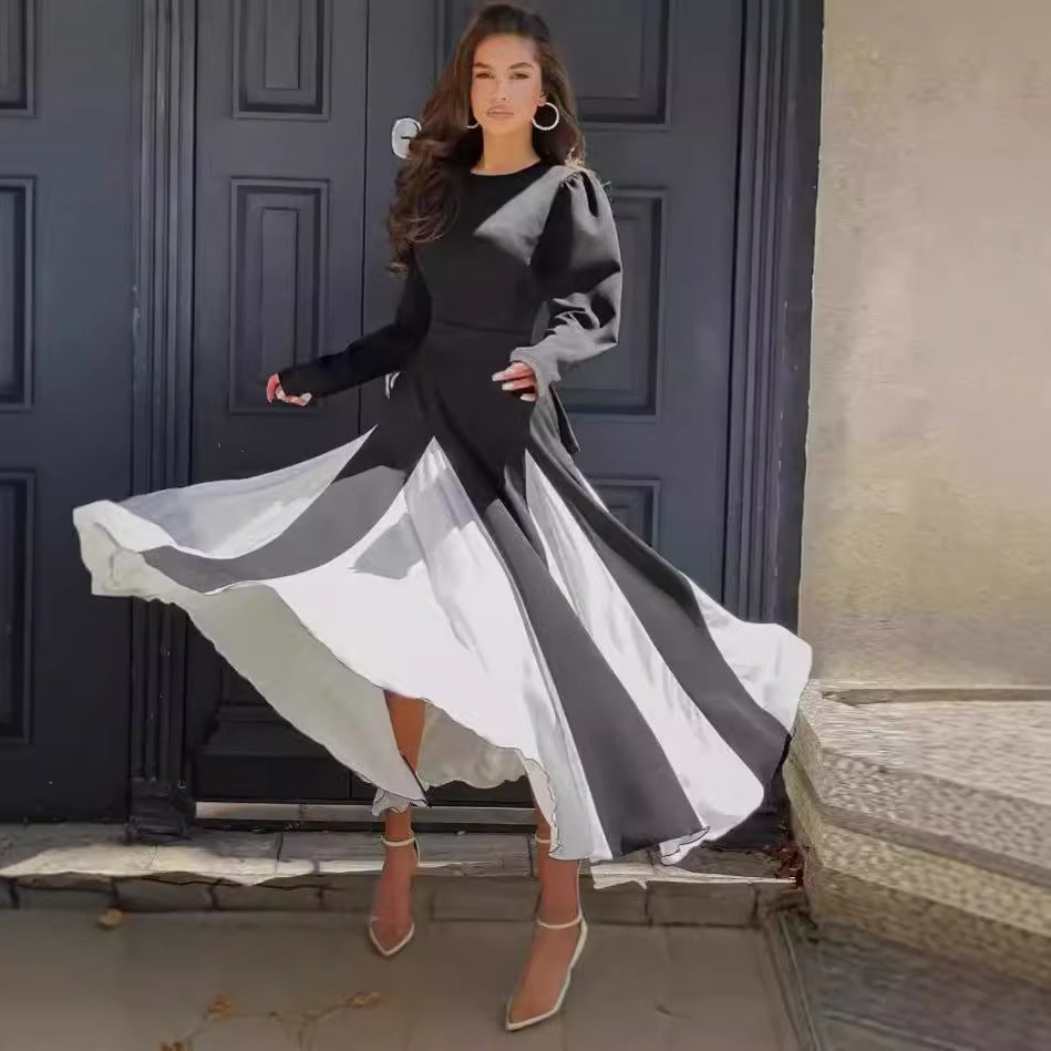 Damernas Elegant Långärmad Klänning med Puffärmar och Flödande Söm Mirla-Eva Jonsson