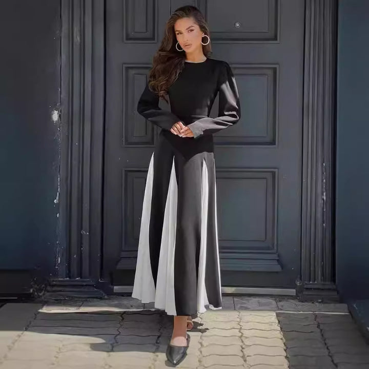 Damernas Elegant Långärmad Klänning med Puffärmar och Flödande Söm Mirla-Eva Jonsson