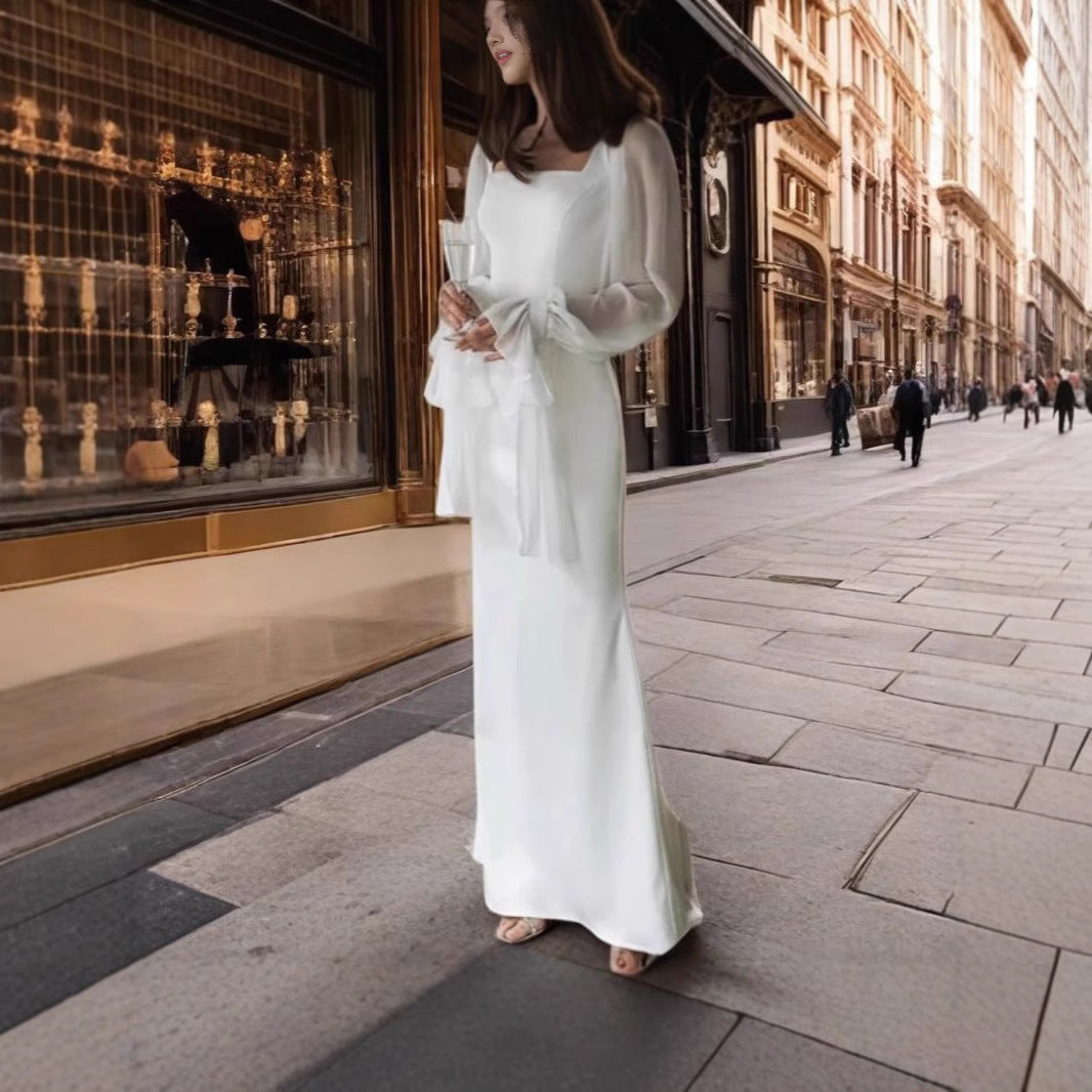Damernas Elegant Maxiklänning med Transparenta Puffärmar och Vid Skärning Mirla-Eva Jonsson