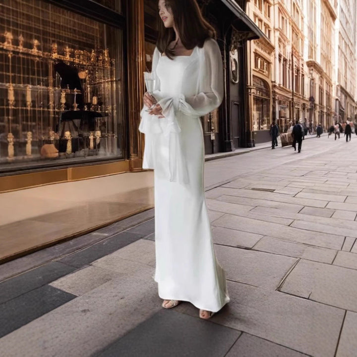 Damernas Elegant Maxiklänning med Transparenta Puffärmar och Vid Skärning Mirla-Eva Jonsson
