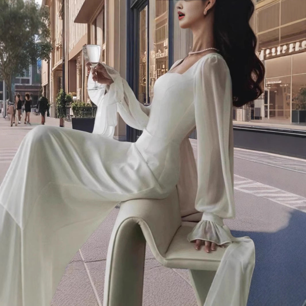 Damernas Elegant Maxiklänning med Transparenta Puffärmar och Vid Skärning Mirla-Eva Jonsson