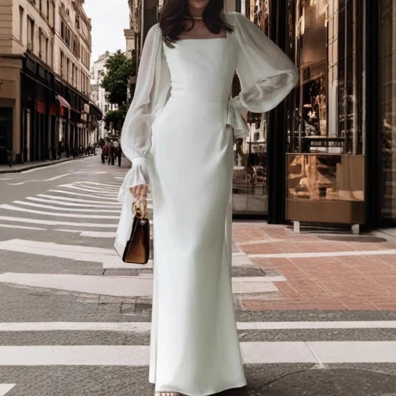 Damernas Elegant Maxiklänning med Transparenta Puffärmar och Vid Skärning Mirla-Eva Jonsson