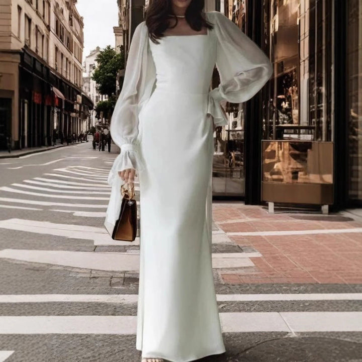 Damernas Elegant Maxiklänning med Transparenta Puffärmar och Vid Skärning Mirla-Eva Jonsson