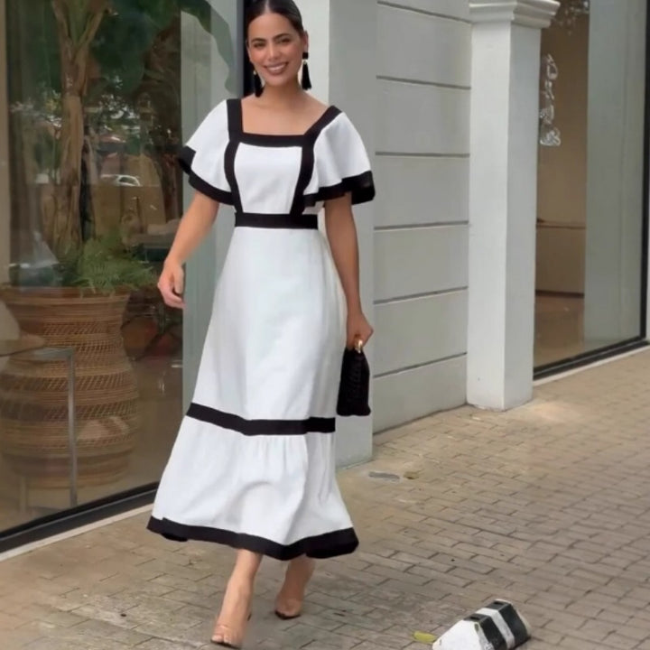 Damernas Elegant Maxiklänning med kontrasterande volangdetaljer Mirla-Eva Jonsson