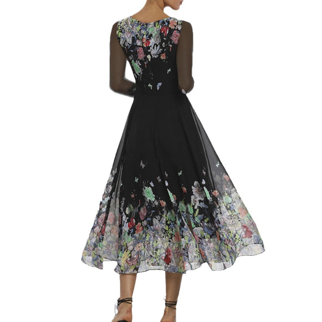 Damernas Eleganta Blomma-Maxi-Klänning med Transparanta Ärmar och Flödande Snitt Mirla-Eva Jonsson