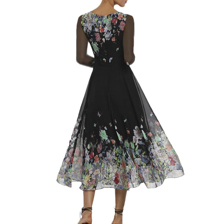 Damernas Eleganta Blomma-Maxi-Klänning med Transparanta Ärmar och Flödande Snitt Mirla-Eva Jonsson