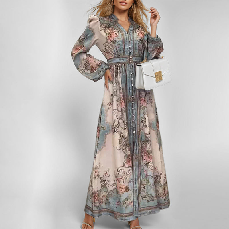 Damernas Eleganta Maxiklänning med Konstfull Blommönster och Figurformande Bälte Mirla-Eva Jonsson