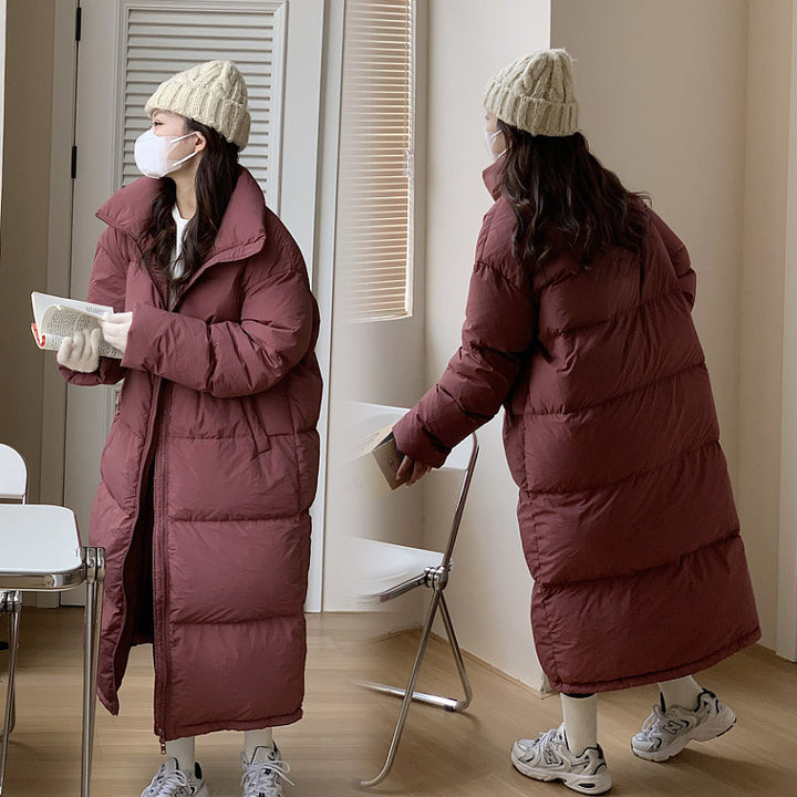 Damernas Lång Pufferjacka med Huva och Voluminös Design Mirla-Eva Jonsson