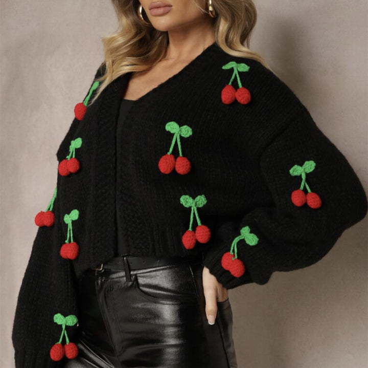 Damernas Lekfull cardigan i stickat med dekorativa detaljer Eva Jonsson-Eva Jonsson