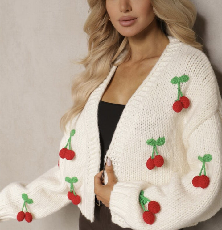 Damernas Lekfull cardigan i stickat med dekorativa detaljer Eva Jonsson-Eva Jonsson