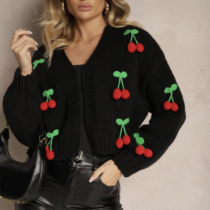 Damernas Lekfull cardigan i stickat med dekorativa detaljer Eva Jonsson-Eva Jonsson