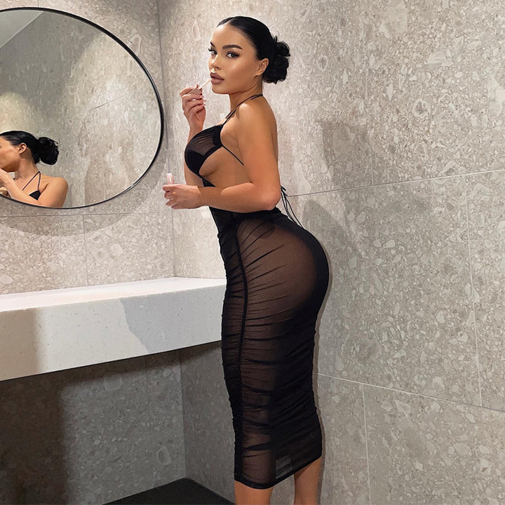 Damernas Transparent Bodycon Maxiklänning med djup u-ringning och lekfulla band Mirla-Eva Jonsson