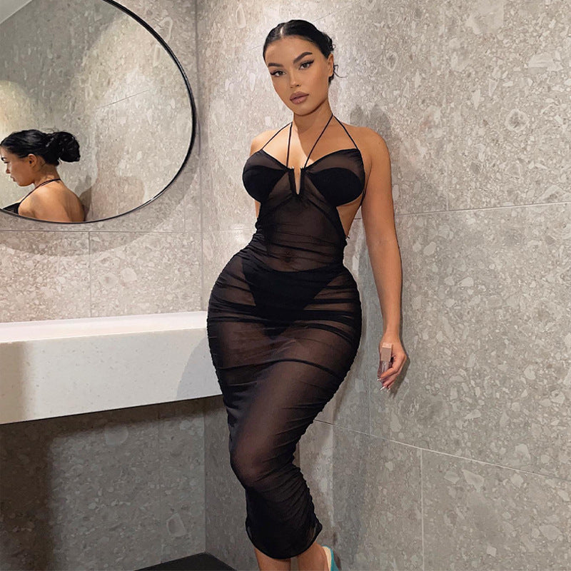 Damernas Transparent Bodycon Maxiklänning med djup u-ringning och lekfulla band Mirla-Eva Jonsson