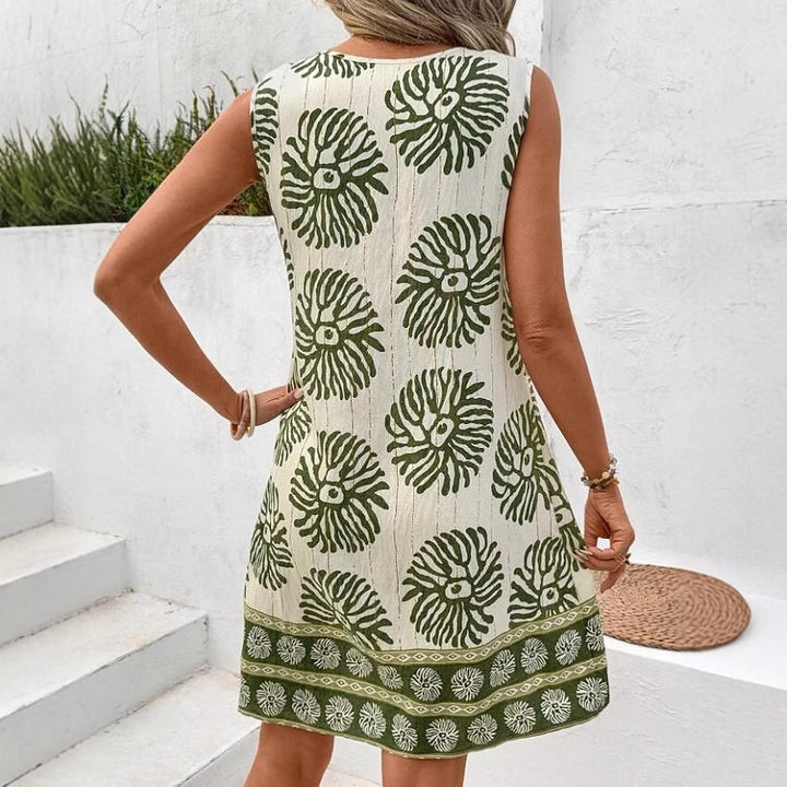 Damernas ärmlösa sommarklänning med lekfullt blommönster och dekorativ nyckelringar detalj Eva Jonsson-Eva Jonsson