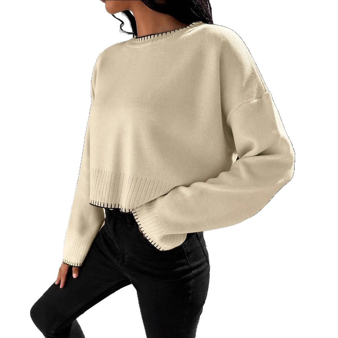 Damernas avslappnade crop-pullover med strukturerade fållar och rundhals. Eva Jonsson-Eva Jonsson