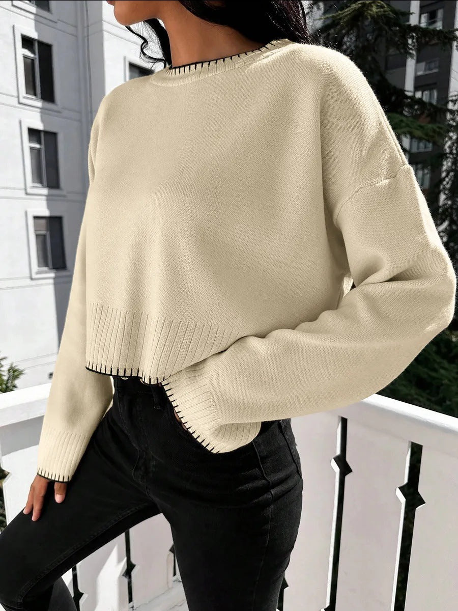 Damernas avslappnade crop-pullover med strukturerade fållar och rundhals. Eva Jonsson-Eva Jonsson