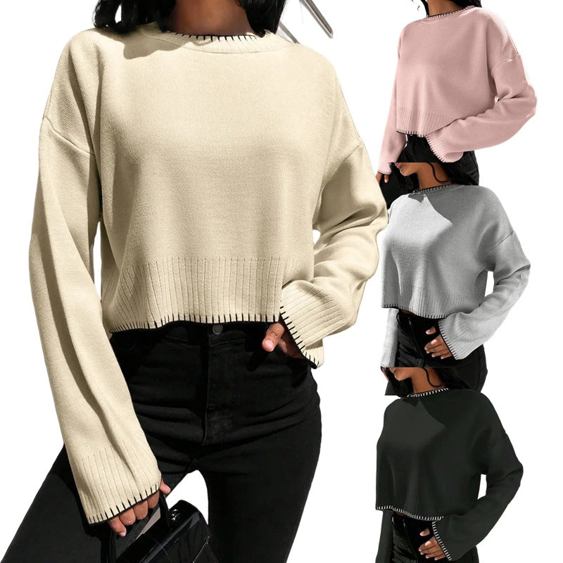 Damernas avslappnade crop-pullover med strukturerade fållar och rundhals. Eva Jonsson-Eva Jonsson