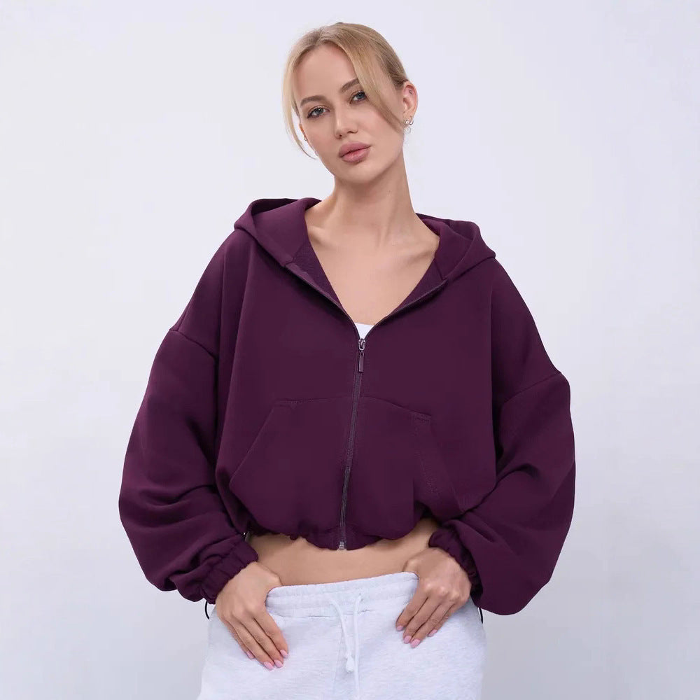 Damernas avslappnade croppad huvtröja med dragkedja och vida ärmar Eva Jonsson-Eva Jonsson