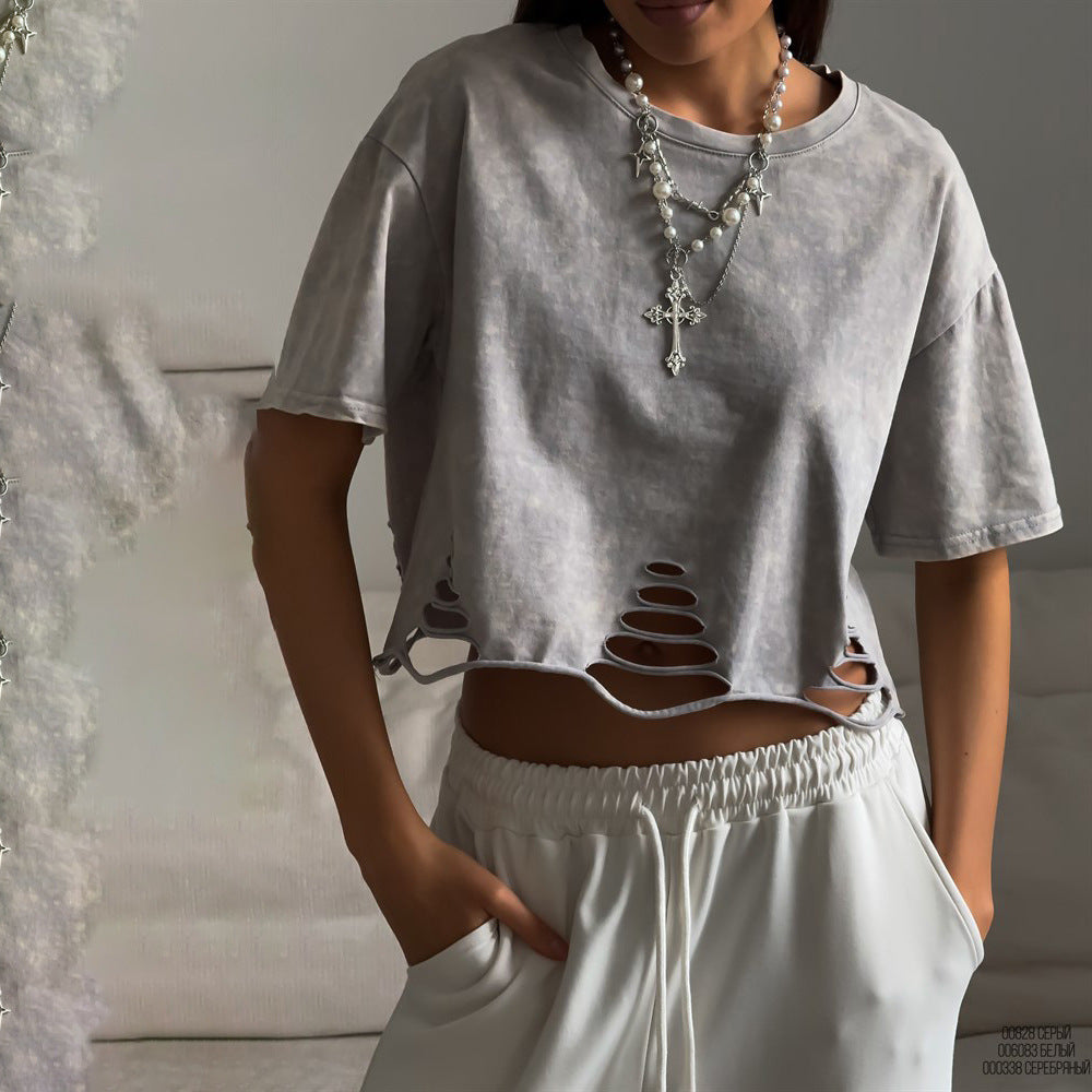 Damernas avslappnade cropped T-shirt med unik skärning och öppna detaljer Mirla-Eva Jonsson