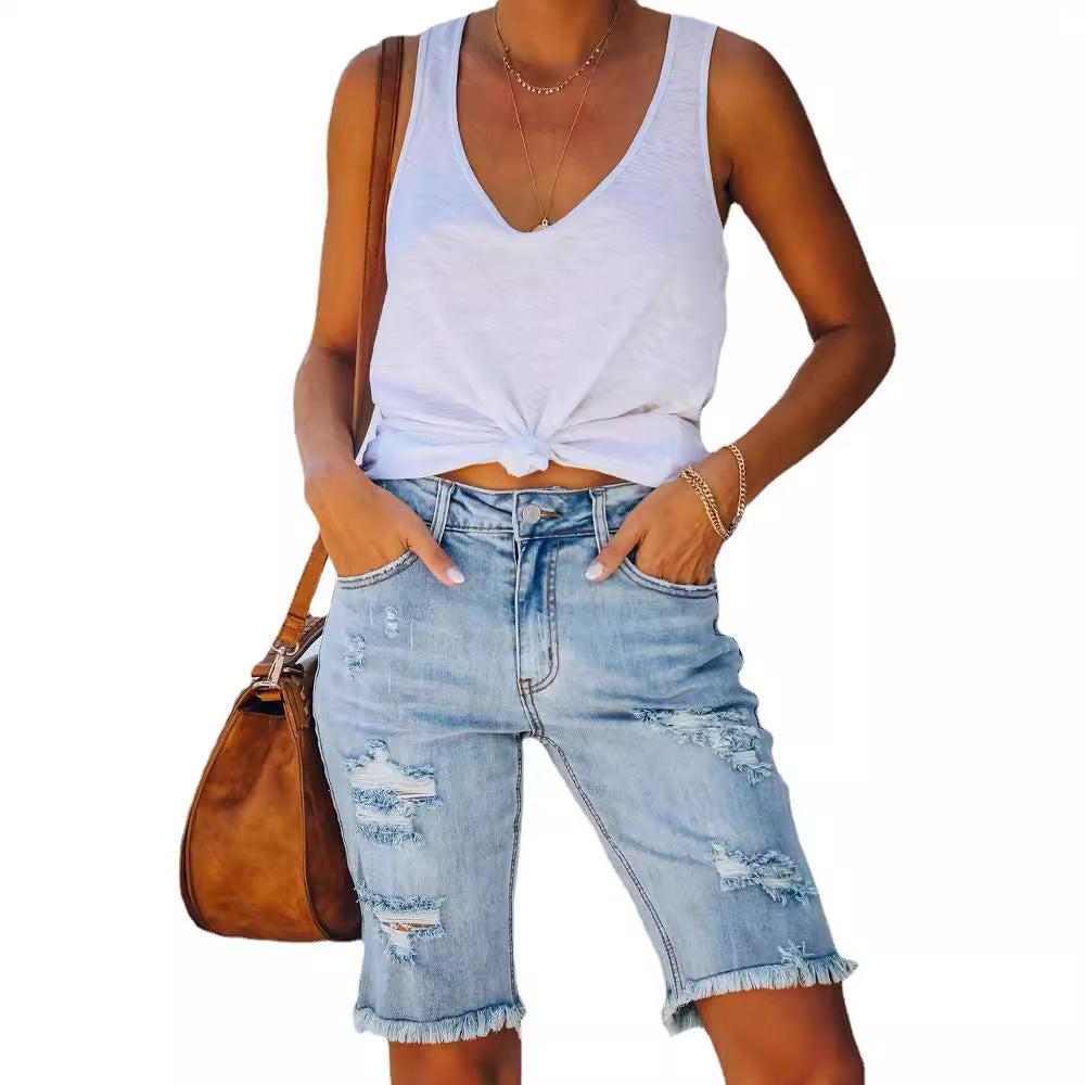 Damernas avslappnade denimshorts med fransad kant och iögonfallande used-look Mirla-Eva Jonsson
