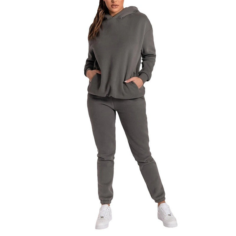 Damernas avslappnade hoodie-träningsdräkt med praktiska fickor och elastisk midja Mirla-Eva Jonsson