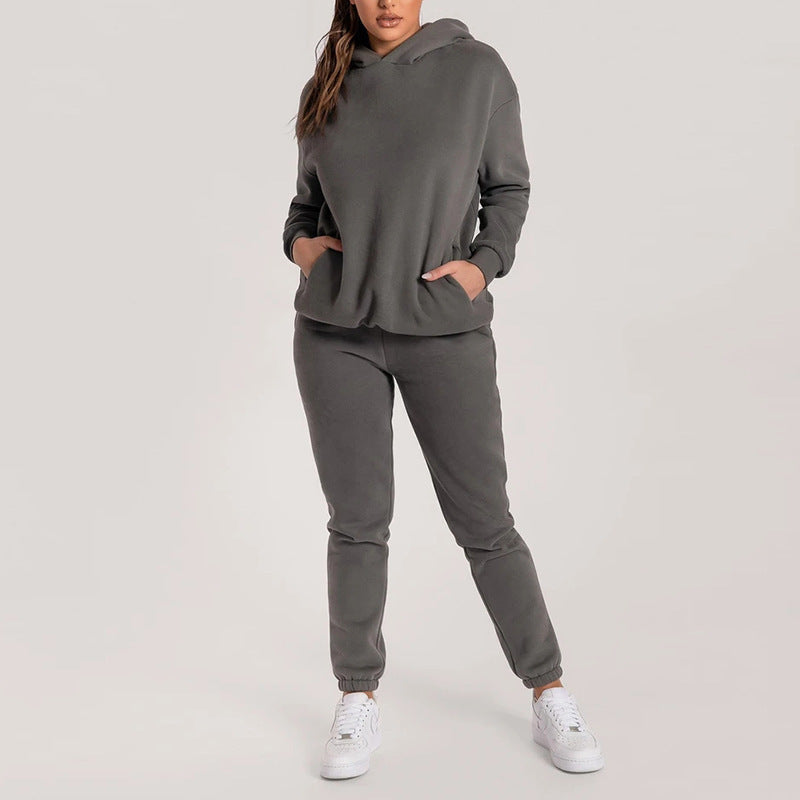 Damernas avslappnade hoodie-träningsdräkt med praktiska fickor och elastisk midja Mirla-Eva Jonsson