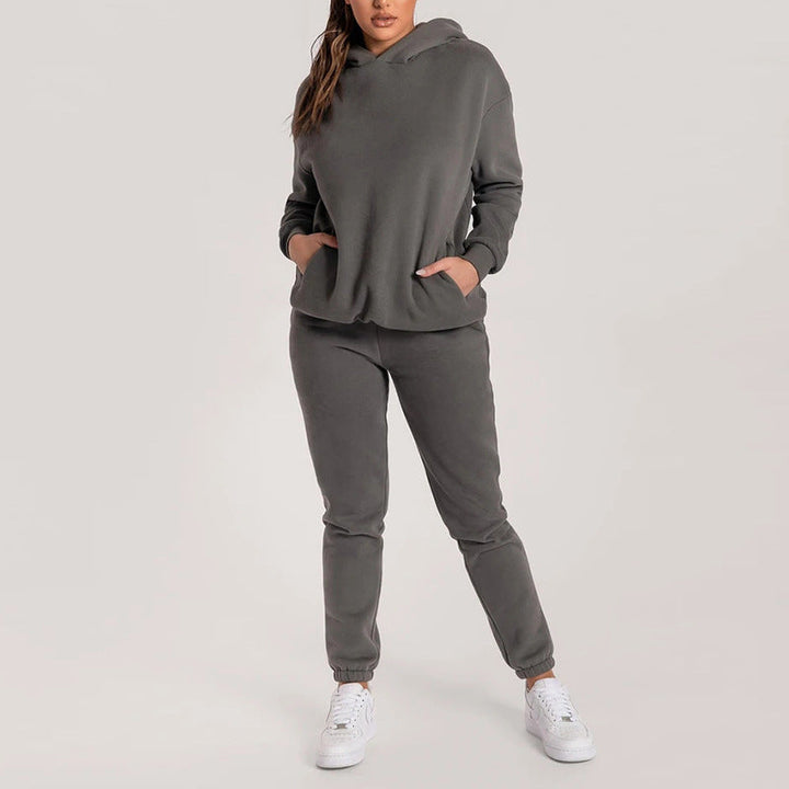Damernas avslappnade hoodie-träningsdräkt med praktiska fickor och elastisk midja Mirla-Eva Jonsson