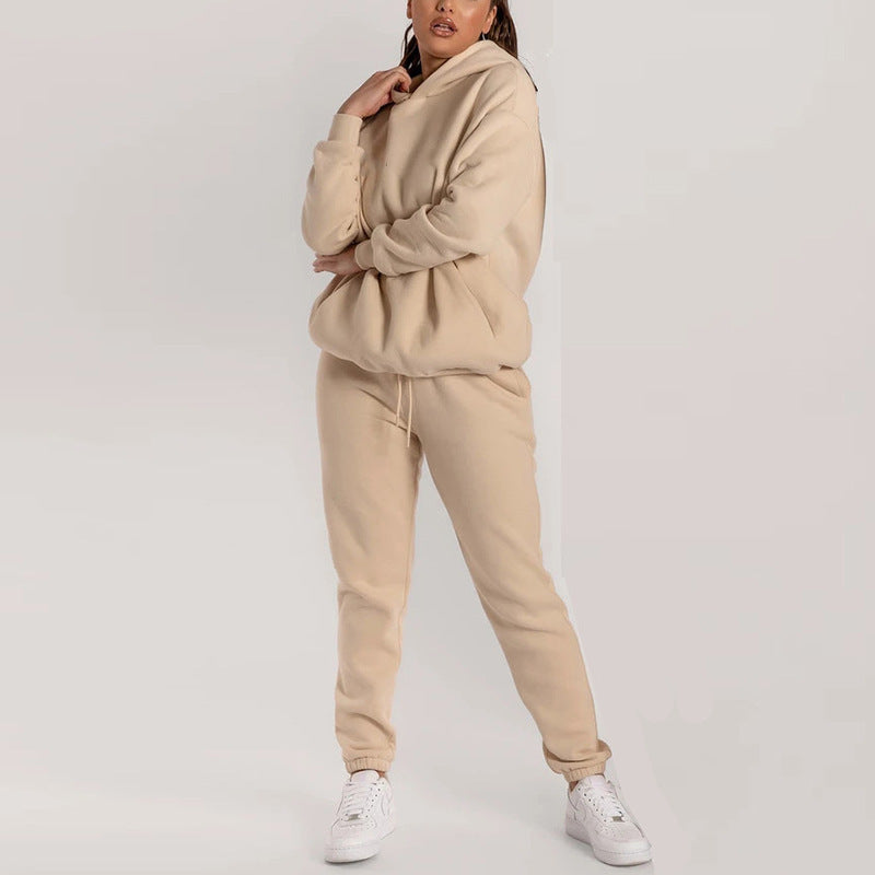Damernas avslappnade hoodie-träningsdräkt med praktiska fickor och elastisk midja Mirla-Eva Jonsson