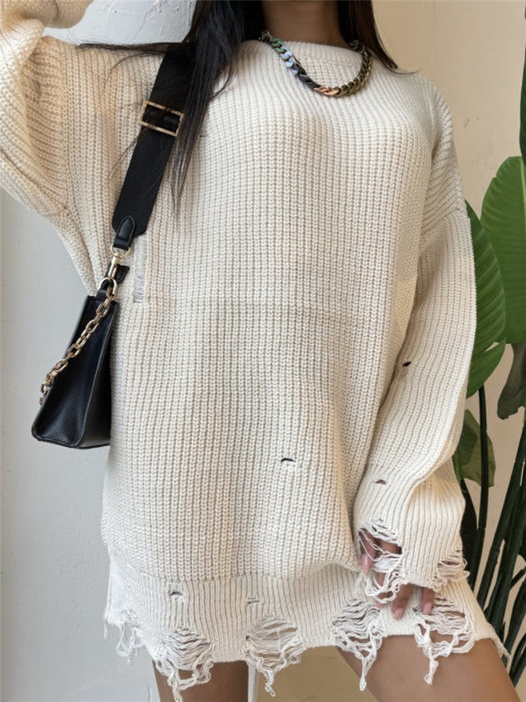 Damernas avslappnade långtröja med strukturerad ribbdesign och öppna sömmar Mirla-Eva Jonsson