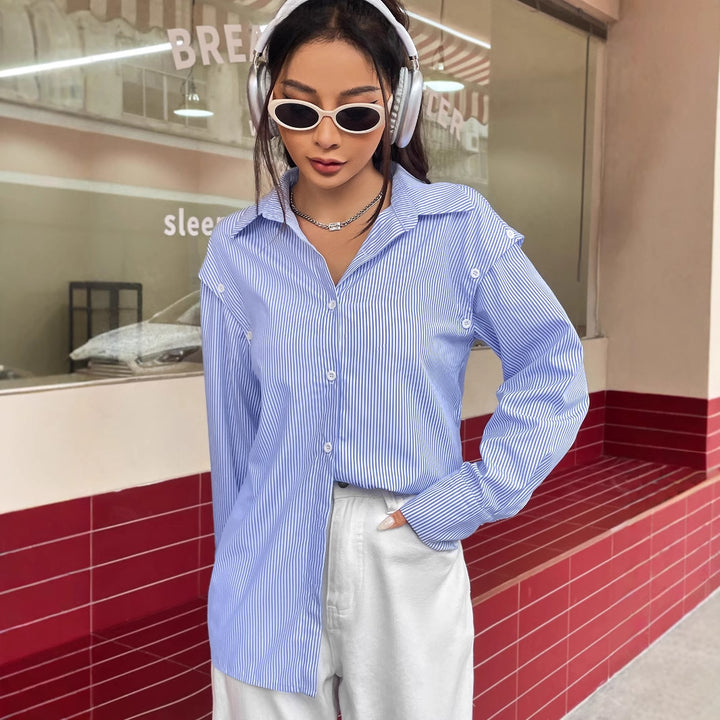 Damernas avslappnade randiga blus med oversized passform och knappar detaljer Mirla-Eva Jonsson