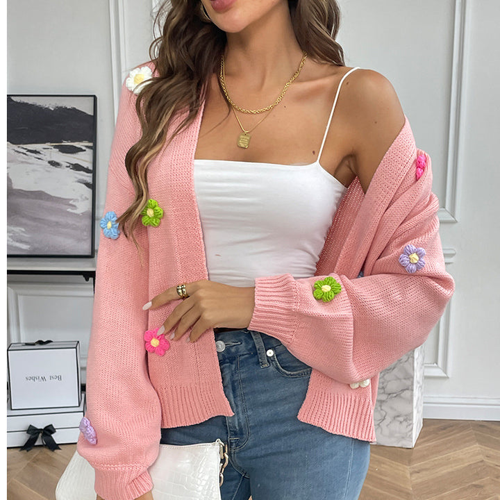 Damernas avslappnade stickad cardigan med färgglada blomapplikationer Mirla-Eva Jonsson