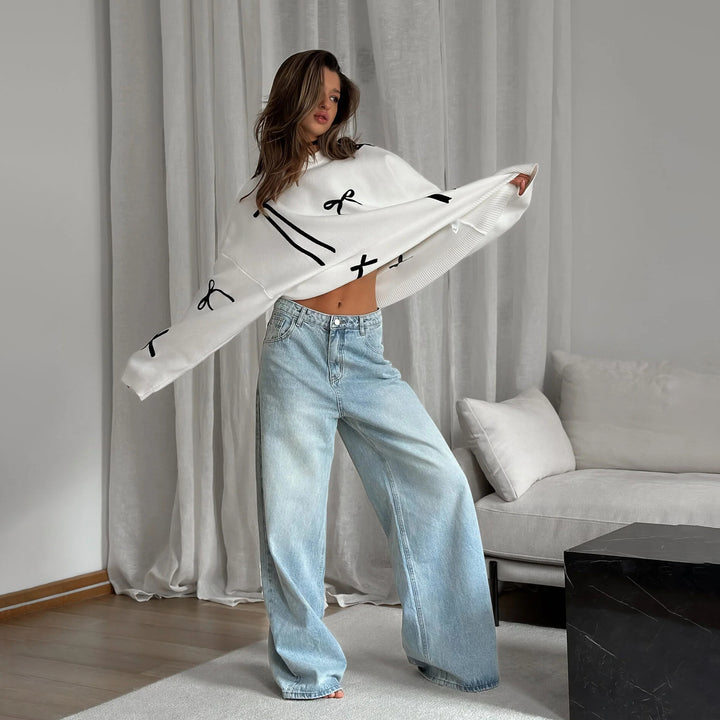 Damernas avslappnade stickad tröja med unika sling-applikationer Mirla-Eva Jonsson