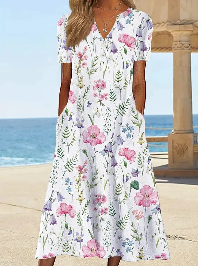 Damernas blommönstrade sommarklänning med fickor Mirla-Eva Jonsson