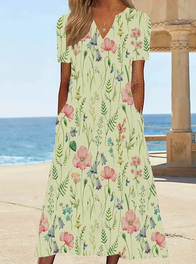 Damernas blommönstrade sommarklänning med fickor Mirla-Eva Jonsson