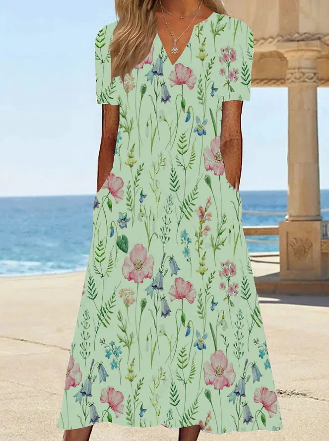 Damernas blommönstrade sommarklänning med fickor Mirla-Eva Jonsson