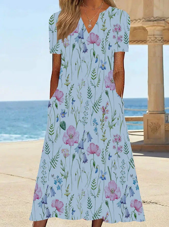 Damernas blommönstrade sommarklänning med fickor Mirla-Eva Jonsson