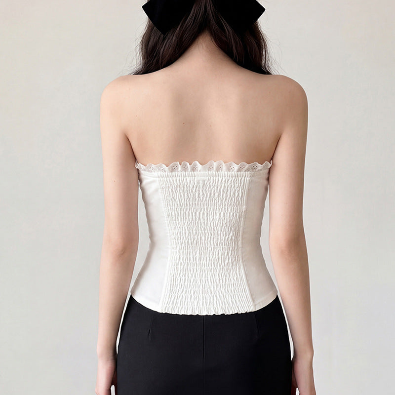 Damernas bustier-top med dekorativ volangkant och knappdetaljer Mirla-Eva Jonsson