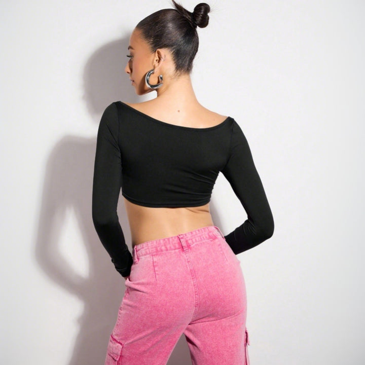 Damernas crop top med asymmetrisk skärning och långa ärmar Mirla-Eva Jonsson