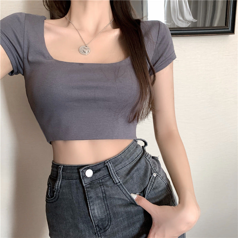 Damernas crop top med åtsittande rund hals och figurnära passform-Eva Jonsson