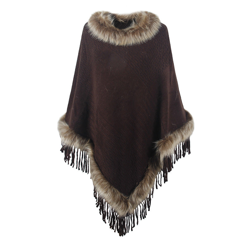 Damernas elegant poncho med lyxig fuskpälskrage och dekadenta fransar Mirla-Eva Jonsson